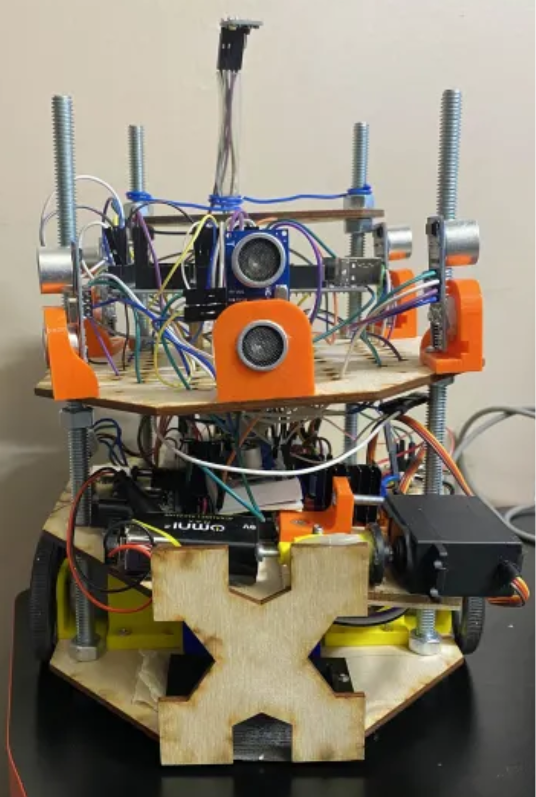 Autonomous maze-solving robot with ultrasonic sensor array and 3D-printed chassis